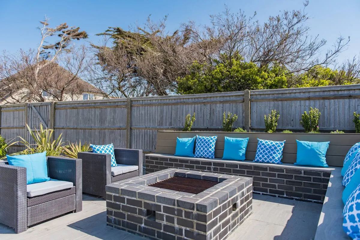 The fire pit on the sunset-facing deck
