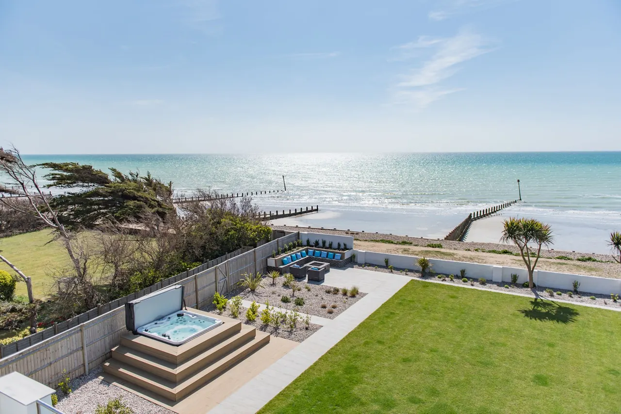 Sun Beach House from the beach, with its garden and balcony facing the sea